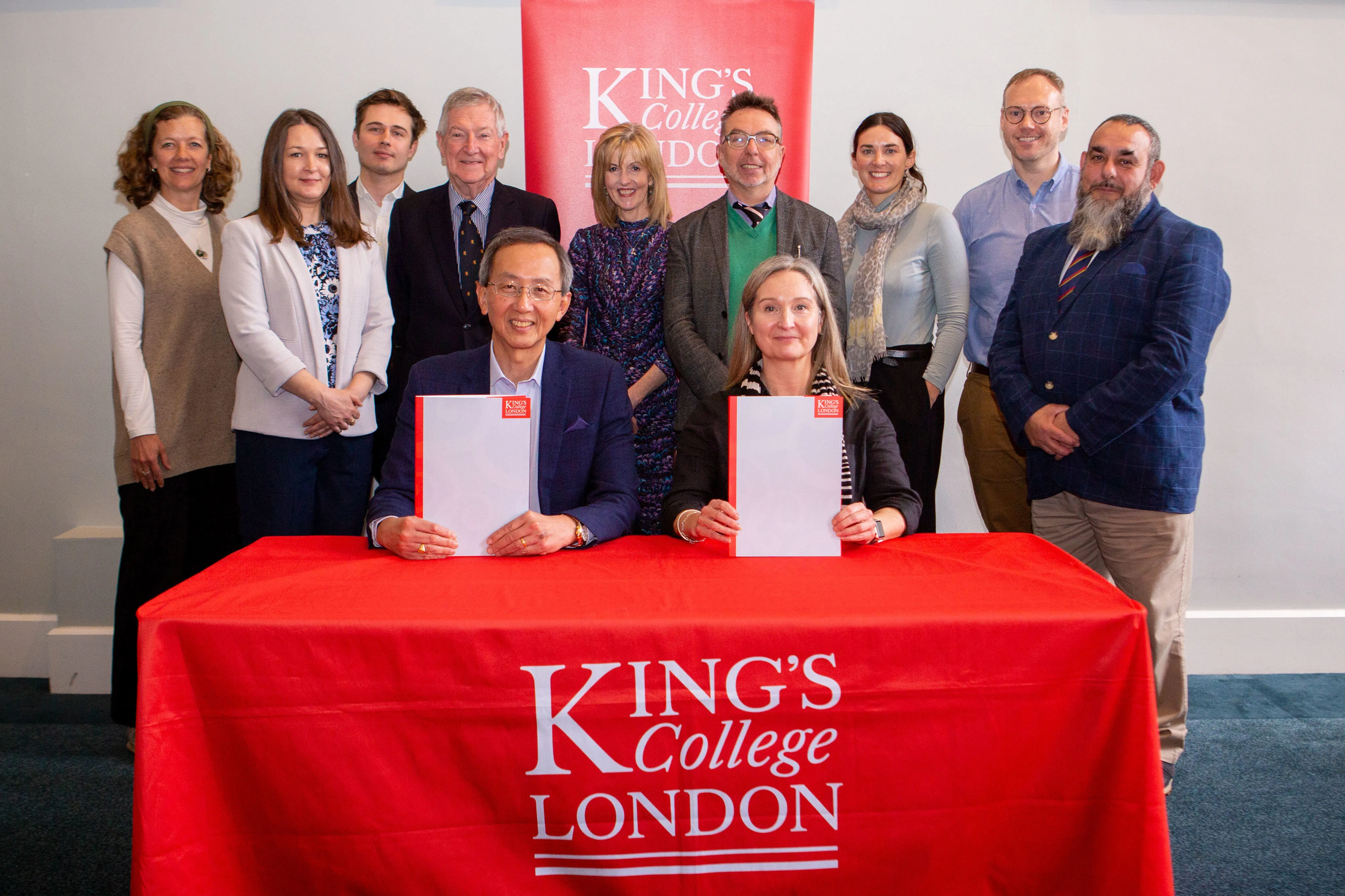 Representatives from HKU SPACE and King's attend the signing of a partnership agreement, May 2024