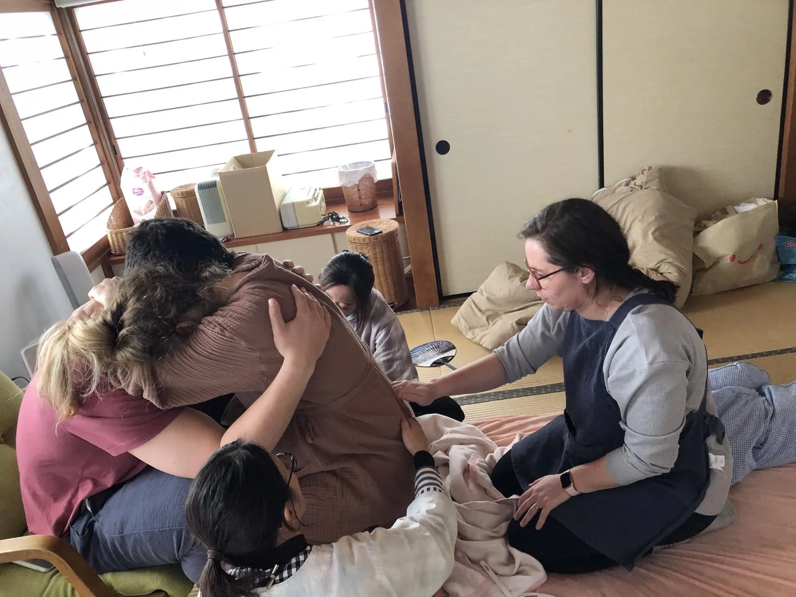 Kelly assists during a birth in Japan
