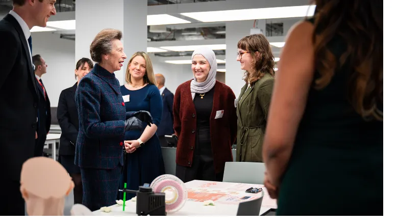 The Princess Royal speaking with members of King's during the official opening of the Quad