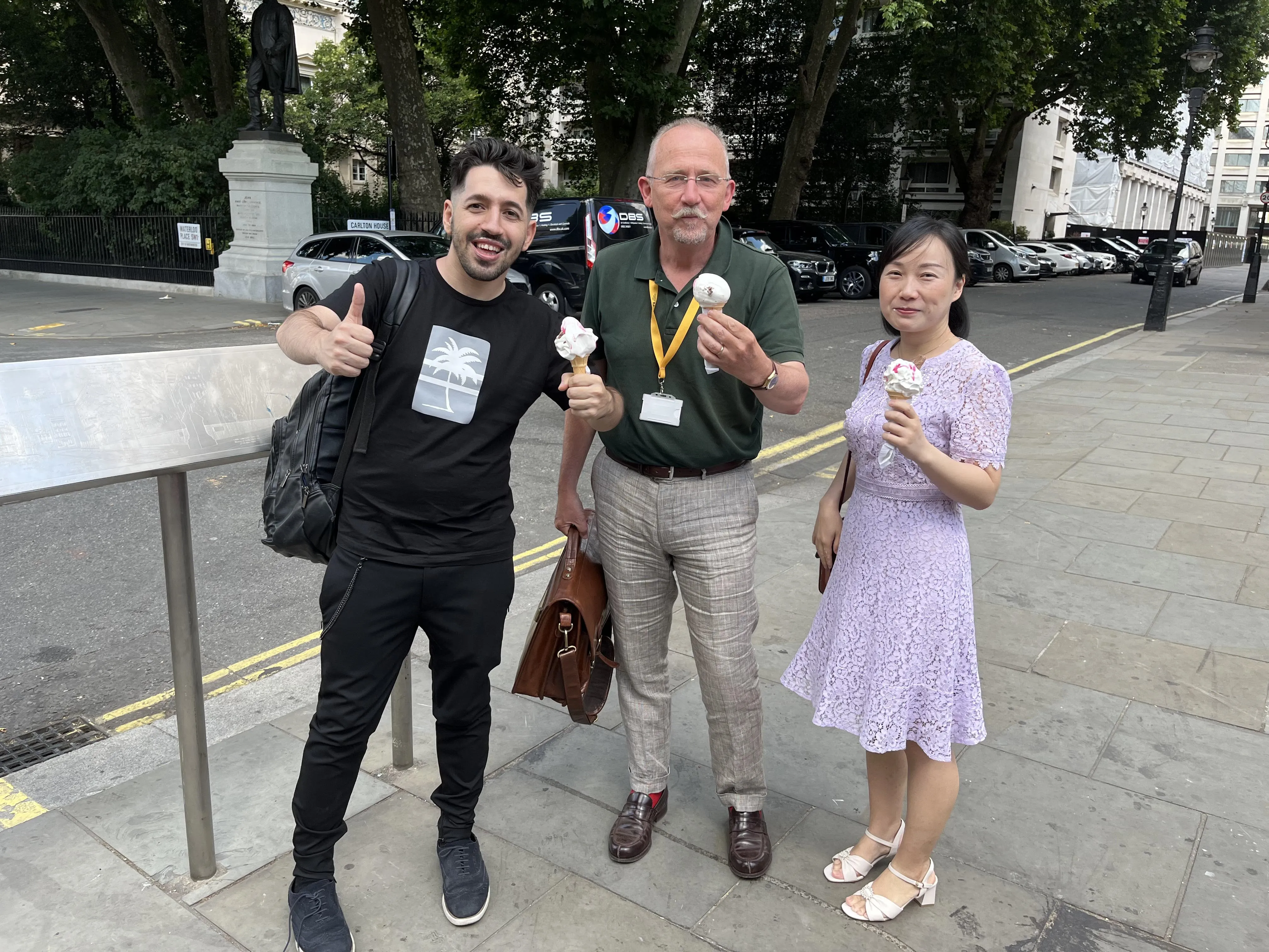 Tao Coll Martin, Edmund Sonuga-Barke and Le Zhao eating ice cream on a London street