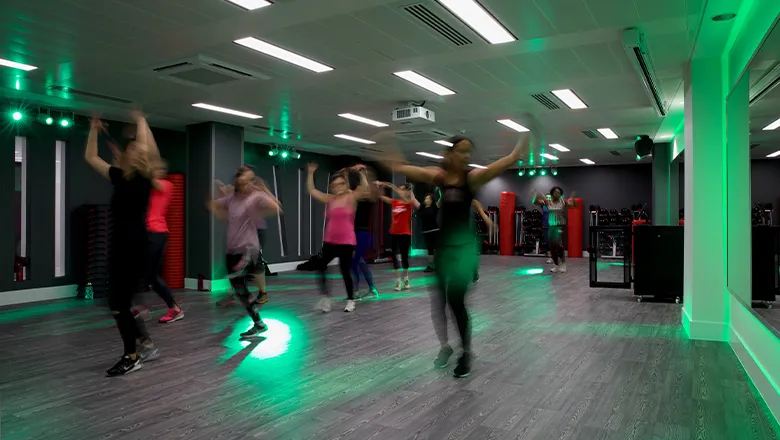 Members participating in a Zumba class in Studio 1. 