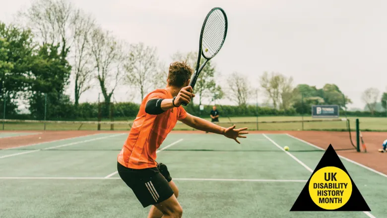 A man playing tennis on a court, displaying agility and precision as he serves during an intense game.