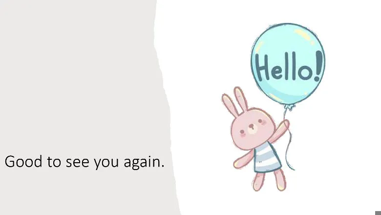 A toy figure holding a balloon with the word Hello! on it