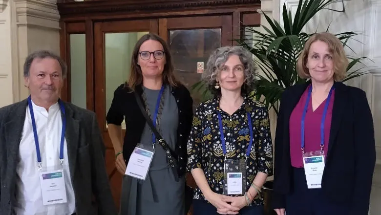 Four people with lanyards on