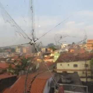A street in Brazil pictured through a broken window 