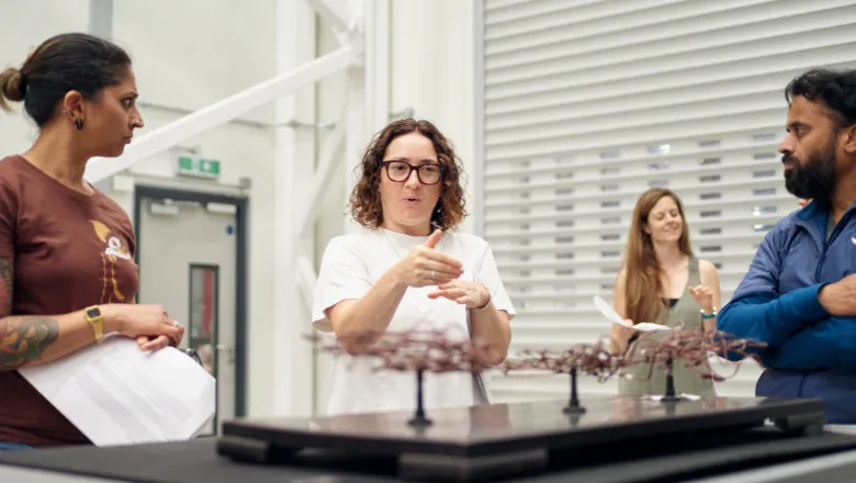 A woman communicating in sign language in a laboratory