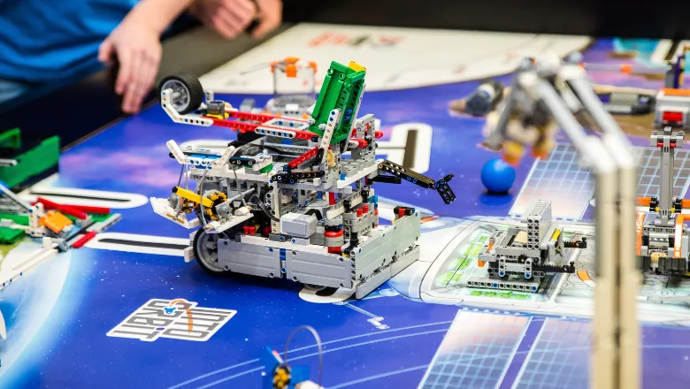 children building robots with lego