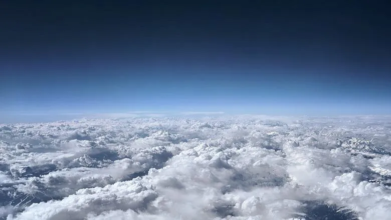 view of the horizon and clouds below
