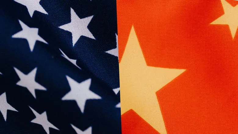 A close up of the American and Chinese flags side by side.