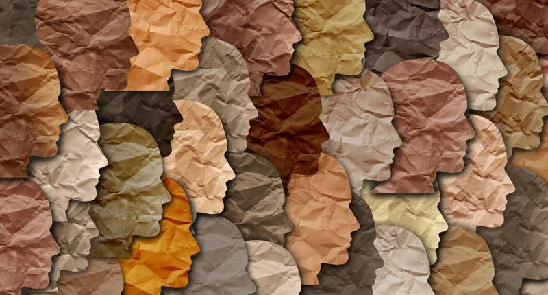 Graphic of paper cut outs of faces in many shades of brown