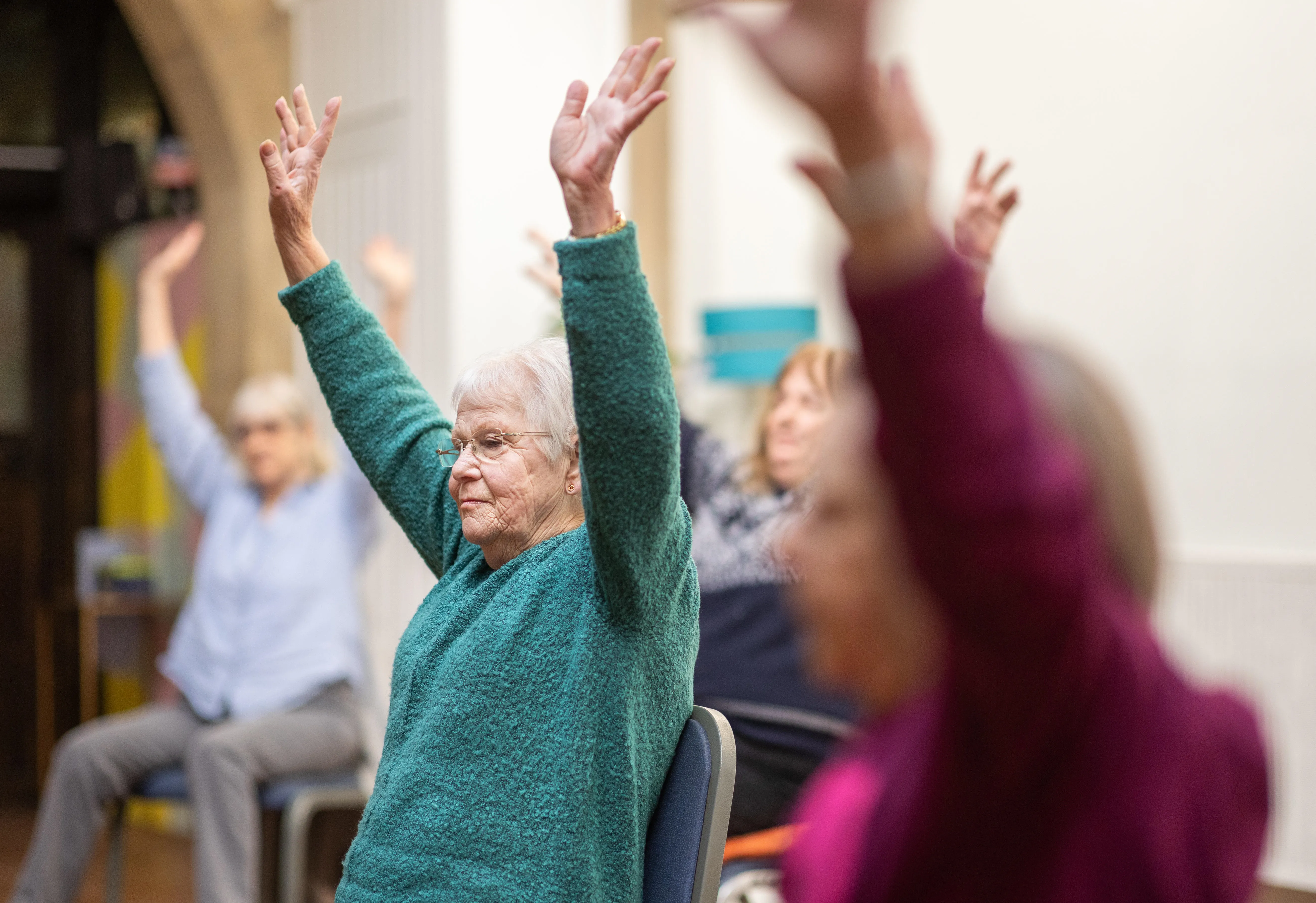 Centre for ageing better_People in exercise class sitting down