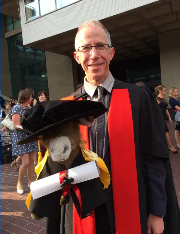 Professor David Green at graduation with the Geography Department Mascot, July 2014