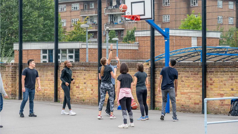 Students playing basketball.