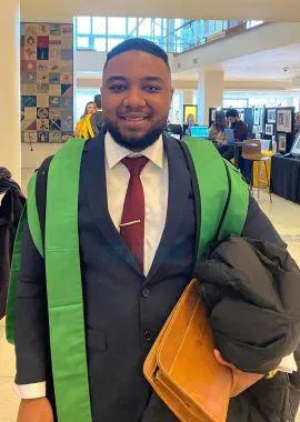 Smiling student in graduation robes