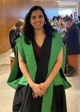 Smiling student in graduation robes