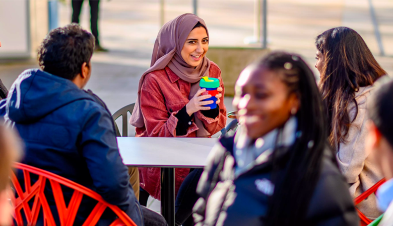 students outside drinking coffee_rsz