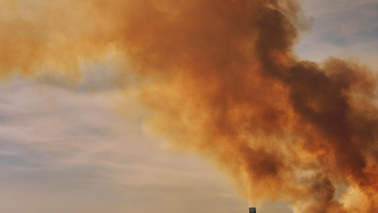 Image of red orange smoke from factory