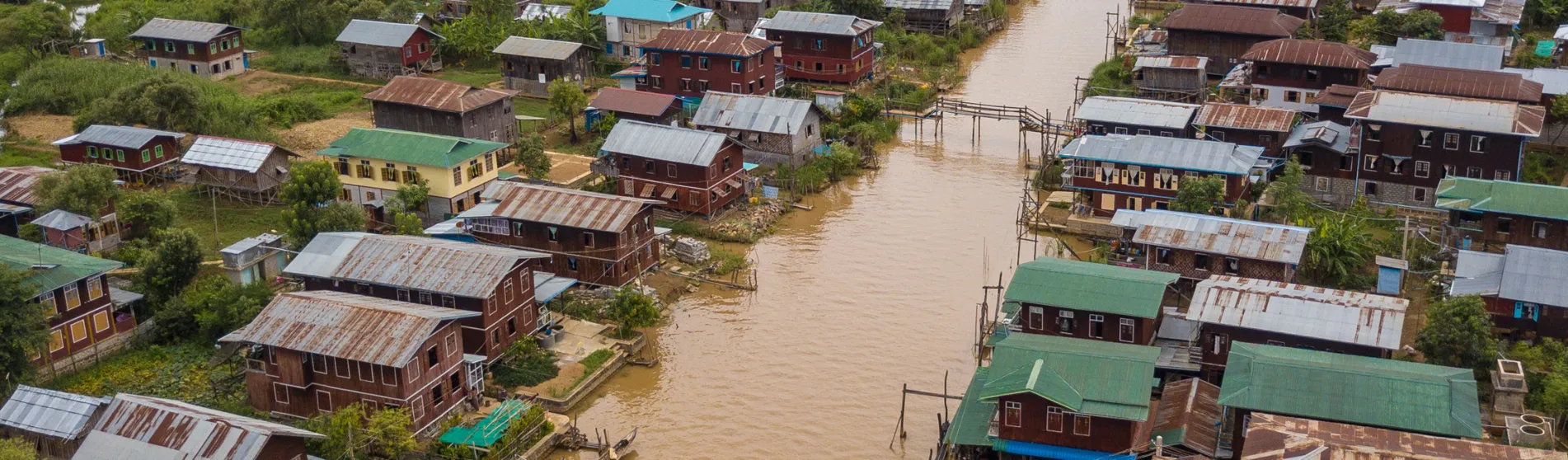 Flooded houses by a river